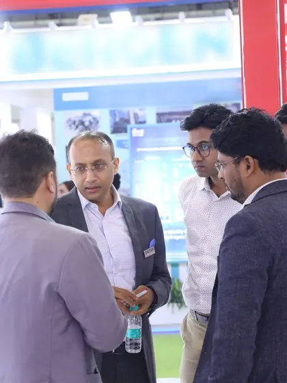 Our leadership team in discussion with visitors at the REI Expo, demonstrating our hands-on approach to customer engagement.
