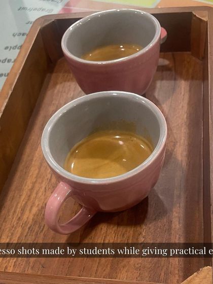 Two perfect espresso shots pulled by our students during their practical exam. Consistency in extraction is a key marker of a skilled barista, and it's something we drill down on.