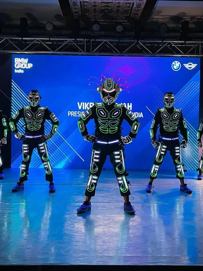 On stage for a major corporate event for BMW. Our Tron dancers are in formation, ready to deliver a high-energy performance that matches the innovation of the brand.