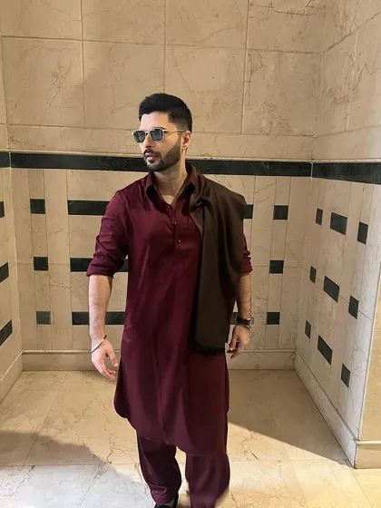 My trademark Pathani suit, worn with effortless style by actor Mikhael Kantroo. This deep maroon ensemble is a perfect example of bold, timeless design, tailored for a sharp silhouette that commands attention.