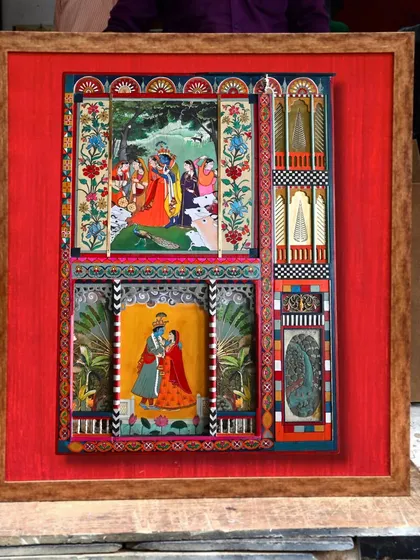 The completed artwork, framed against a vibrant red Banarasi silk. The five-month journey from scrap to story is complete, with the panel now a fine art piece ready to be displayed.