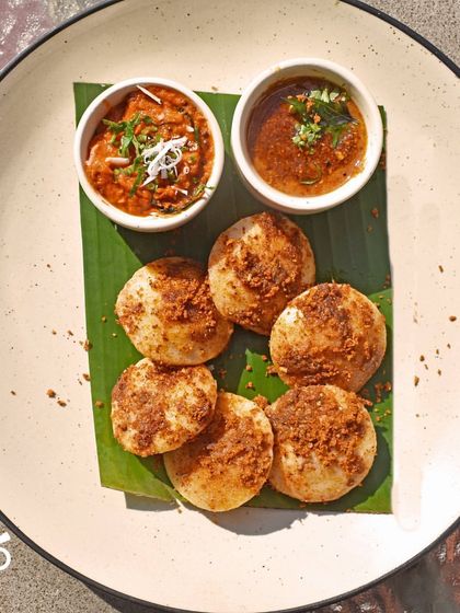 For those who like a little spice, my Podi Idlis are a must-try. Soft idlis tossed in a fragrant and spicy 'podi' masala, served with sambar and chutney. It’s a flavor explosion!