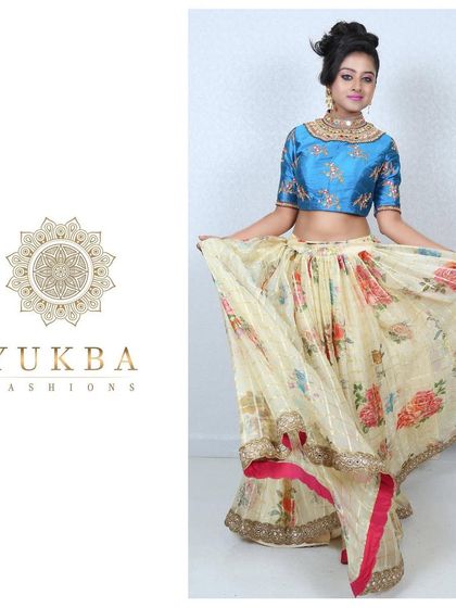 A playful shot of the model showcasing the beautiful flare of the floral print lehenga skirt.