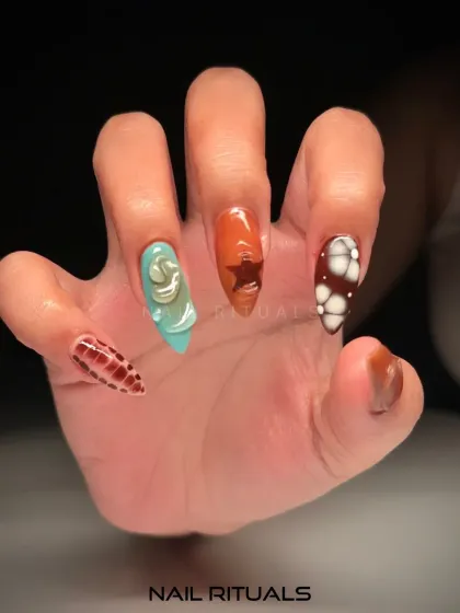 A close-up of our 3D textured art. This image highlights the intricate details of a single hand, showing off designs like a turquoise swirl and a brown star.