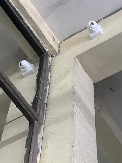 Two dome cameras placed to cover intersecting zones. This overlapping coverage ensures there are no gaps in surveillance.