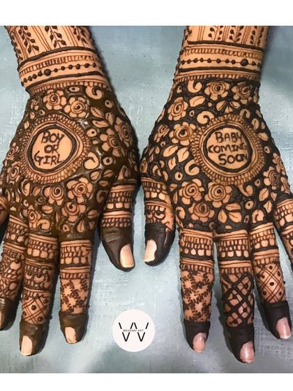 The back of the hands for a baby shower, continuing the floral mandala theme with the exciting "Boy or Girl?" question.