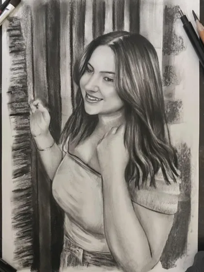 A charcoal sketch capturing a woman's bright smile and the flow of her hair.