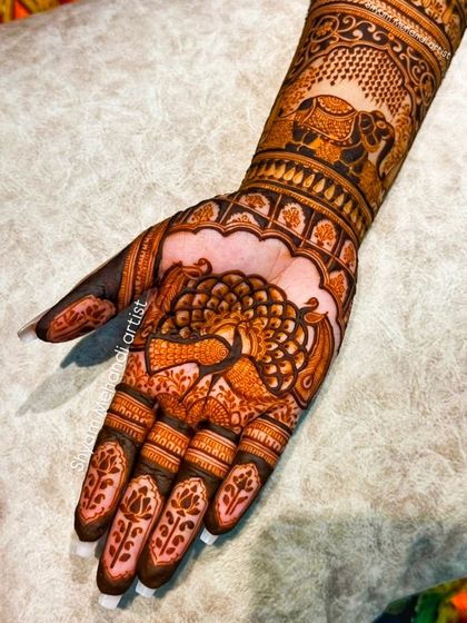 Another angle of the peacock and elephant design, highlighting the clean lines and shading.