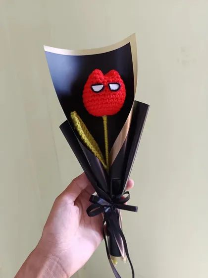 A single Spiderman tulip, wrapped and ready as a perfect small gift.
