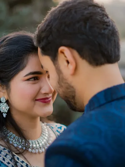 Beyond the grand locations, we focus on the quiet moments of connection. This intimate close-up captures a gentle, loving glance, showcasing our ability to direct and capture genuine emotion between a couple.