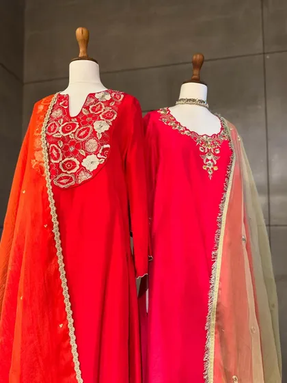 A side view of these festive kurtas, highlighting the sheer organza dupattas and the way they complement the rich, solid colors of the silk.