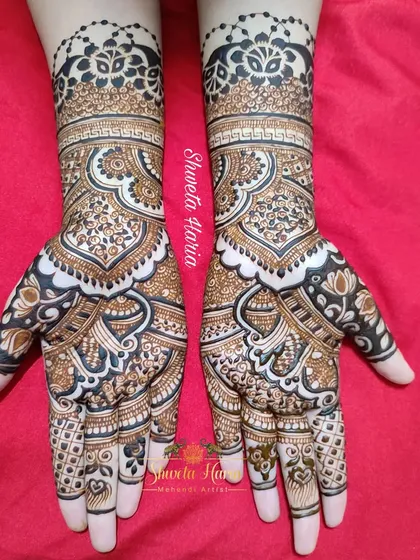 A beautiful fusion of traditional and floral styles. This full-coverage design features large, intricate paisley shapes filled with delicate flowers and leaves, creating a flowing and organic look.