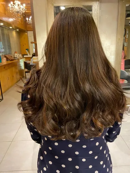 This light brown and golden balayage adds warmth and brightness. It's a great choice for a noticeable but natural-looking change.
