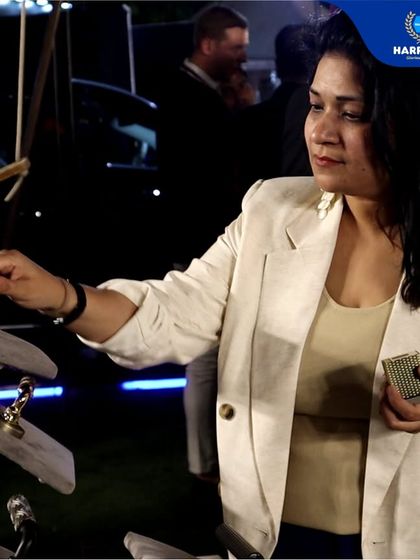 An attendee at the Delhiites Food & Nightlife Awards interacts with my display of premium door handles. It's always rewarding to see people experience the tangible quality and craftsmanship of my products.