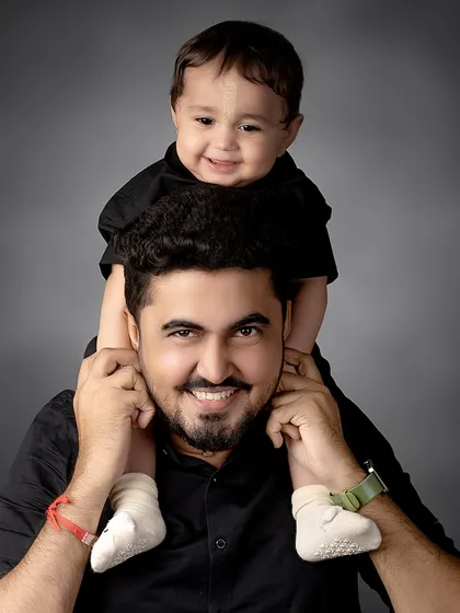 A father's joy. The view from dad's shoulders is always the best, and this portrait captures that special bond perfectly.