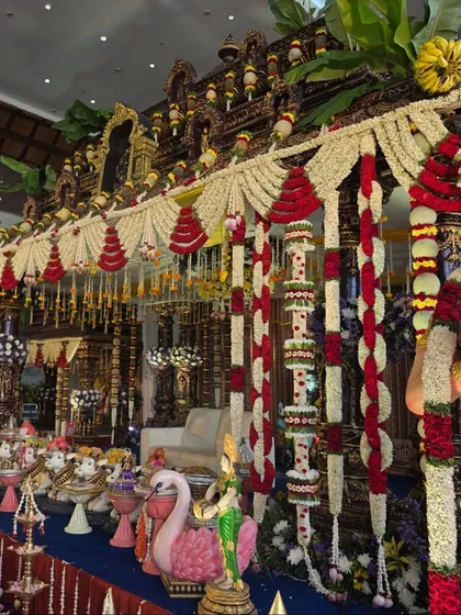 A view of the temple mandapam with a large Hanuman idol.