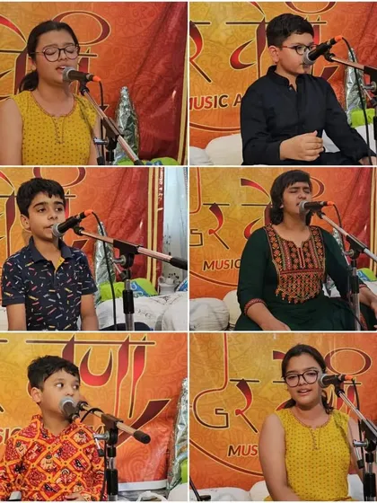 Our young students performing during the Guru Purnima celebrations. They offer their music as a form of respect to the gurus.