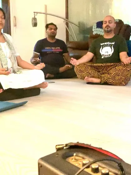 Participants meditating during the Chakra Balancing workshop. The focus here is on deep inner work, learning techniques to self regulate and manage your own energy for long term wellness.