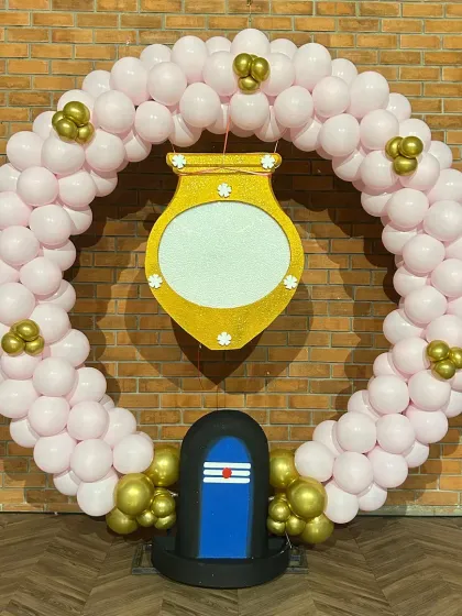 I design decor for traditional ceremonies like this Annaprashan (first rice-eating ceremony). This setup features a circular balloon arrangement with a traditional pot motif and a Shivling cutout, blending modern decor with cultural elements beautifully.