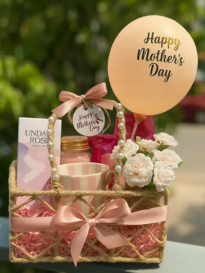 Surprise Mom with a basket full of happiness this Mother's Day! This cheerful gift includes a reed diffuser from H&M, a matching coffee mug, a cute notebook, and sweet treats, complete with a festive balloon to make her smile.