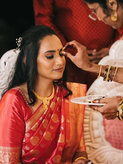 A moment during the ceremony, showing the longevity of the makeup. I use professional products from brands like MAC and PAC to ensure your look stays flawless for hours.