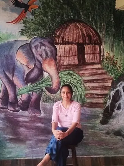 Here I am with the finished Kerala-themed landscape. The elephant, the traditional hut, and the waterfall all come together to create a serene and rustic scene. It brings so much peace to the space.