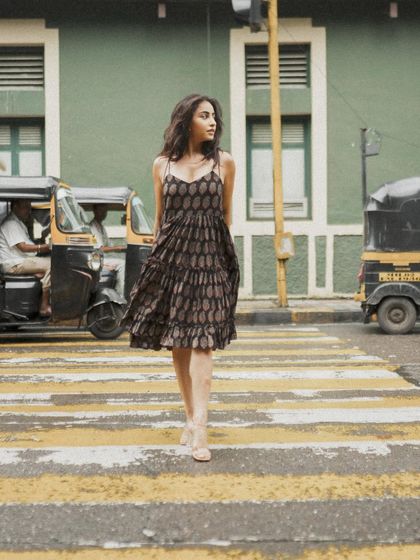 A classic crosswalk shot that captures movement and a candid, in-the-moment feel, perfect for a lifestyle or fashion blog.