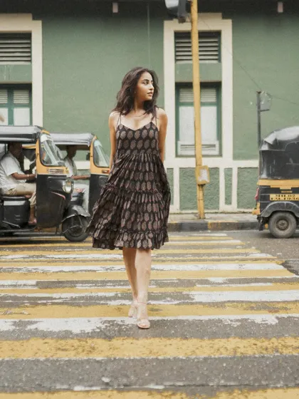 A classic crosswalk shot that captures movement and a candid, in-the-moment feel, perfect for a lifestyle or fashion blog.