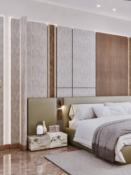 A close-up of the bed and the textured headboard wall, showing the mix of wood and fabric panels.