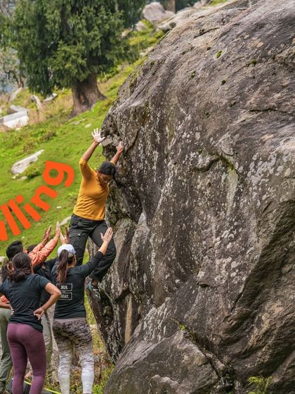 A group of spotters prepares to catch a climber, demonstrating our commitment to safety and trust within the community.