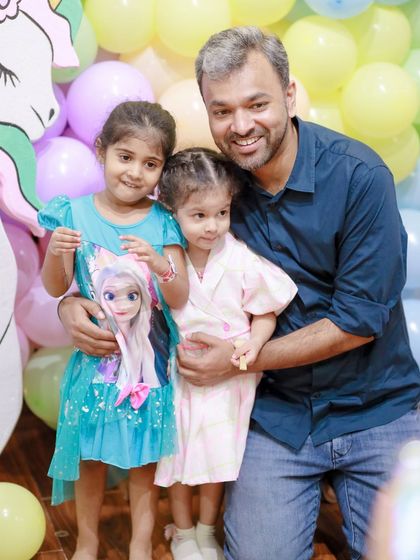 A heartwarming family photo at a unicorn and Frozen-themed party. We love capturing these moments of family joy against the magical backdrops we create.