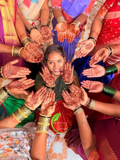 A bride surrounded by her happy tribe. It's always a joy to do mehendi for the entire bridal party, ensuring everyone feels included in the celebration with beautiful henna designs.