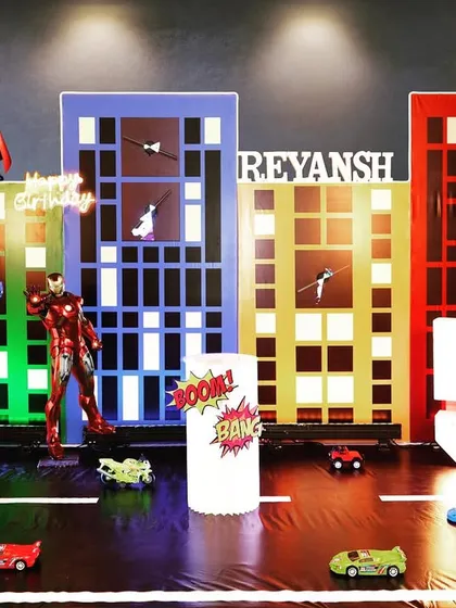 Your child's favorite heroes can assemble for their big day. This is a design concept for an Avengers party, showing how I create a dynamic city scene with 3D character props and custom light-up signs.