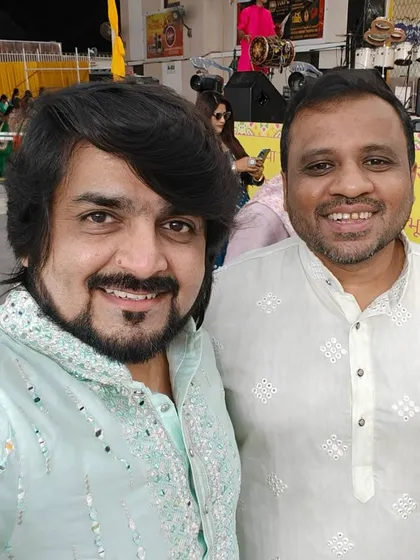 Posing with a friend at the Navratri 2024 event in Muscat. It's always great to connect with familiar faces.