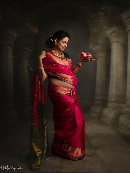 Another artistic composition from this traditional session, focusing on the details of the saree and the symbolic offering of flowers.