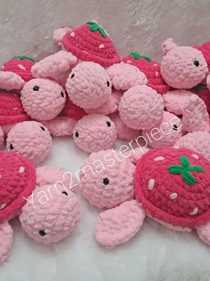 A pile of my strawberry turtle plushies! These were made for a bulk order and feature a cute strawberry design on their shells.