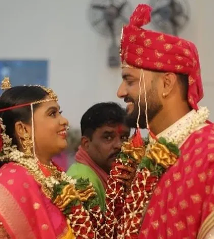 An intimate moment during the wedding rituals. The bride's makeup is soft and beautiful, capturing the emotion of the day.