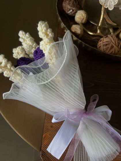 This is one of my favorite ready-to-go combinations. It features white handmade hyacinths and purple tulips, wrapped in delicate white tulle with a lavender ribbon for an elegant finish.