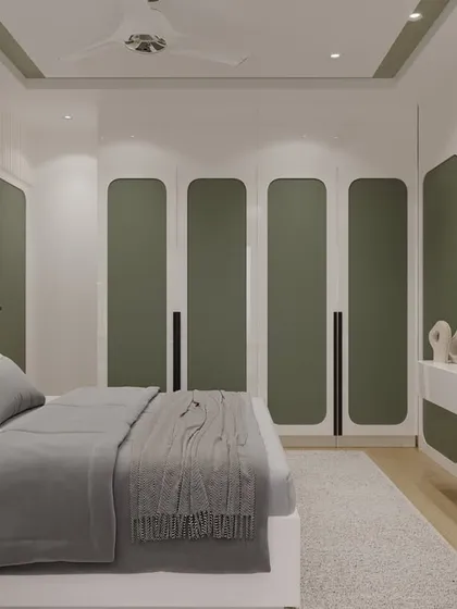 Here, I used an earthy olive green for the custom wardrobe and scalloped headboard to create a calming, nature-inspired feel. The design is complemented by a tropical leaf print wallpaper behind the TV, turning the media unit into a stylish focal point.