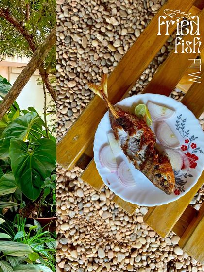 A plate of fried fish enjoyed in a rustic, natural setting in Pondicherry.