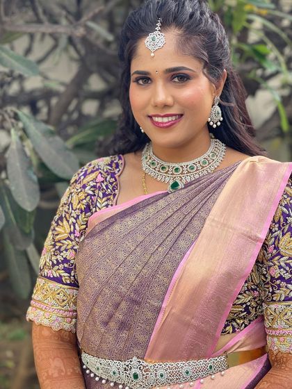 A close-up of the beautiful CZ and emerald set. The vibrant green stones provide a lovely pop of colour against the sparkling white CZ diamonds.