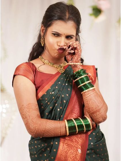 A quirky and fun pose from the bride, showing her playful personality.
