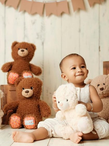 Who is the cutest teddy bear in the room? This classic teddy bear picnic theme is a timeless choice for a baby's milestone photoshoot.