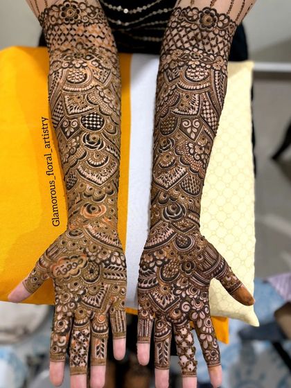 This full bridal design is packed with detail, using a variety of patterns like checks, swirls, and florals to create a rich and textured look.