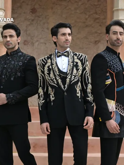 A closer group shot, highlighting the contrasting styles of the heavily embroidered tuxedo and the more subtly detailed bandhgalas.