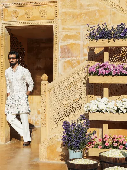 Posing against the beautiful sandstone architecture of Jaisalmer. My traditional outfits are chosen to complement the royal heritage of such stunning locations.