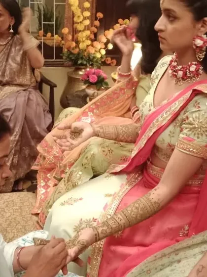 Applying mehendi for the actress, ensuring the design was perfect for the camera.