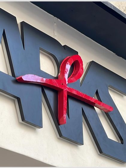 The exterior signage for ARKS, featuring the brand's distinctive logo. The three-dimensional design creates a strong first impression before customers even enter the store.