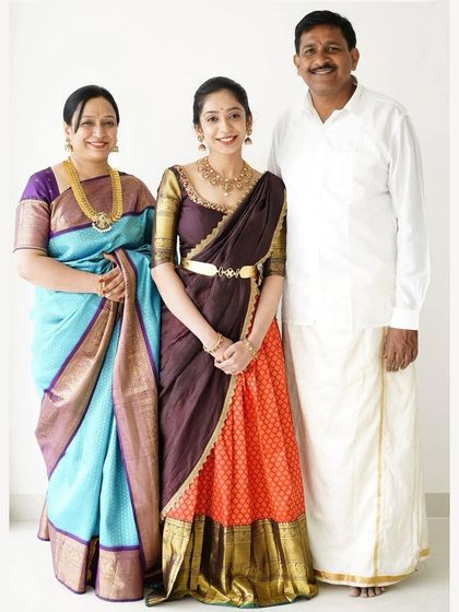 A beautiful family portrait. I am pictured here with my daughter Rachana and my husband, celebrating our store's anniversary.