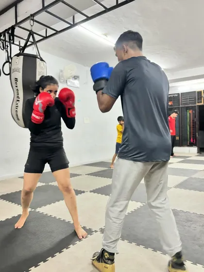 Another shot of a partner drill. This kind of training is crucial for developing the reflexes and distance management needed for a real fight.